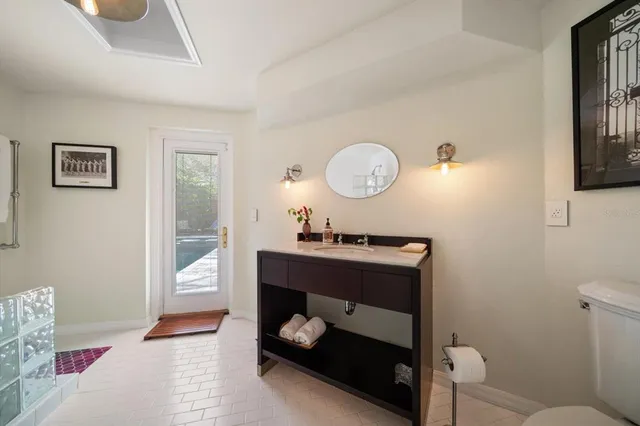 a view of a house with backyard sitting area and garden