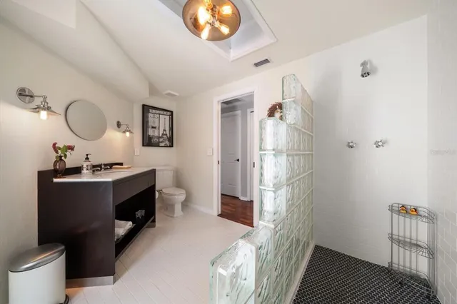 an aerial view of house with yard and mountain view in back