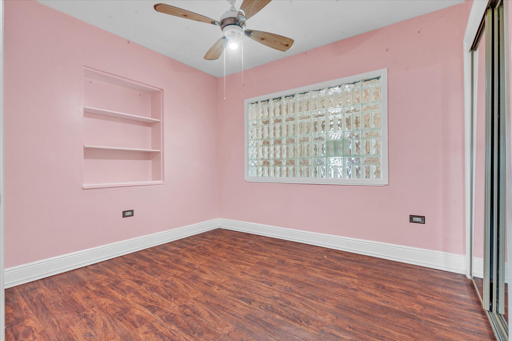 7984 Tuna Drive Marathon, FL 33050 - Photo 16 of 40 a view of empty room with wooden floor and fan