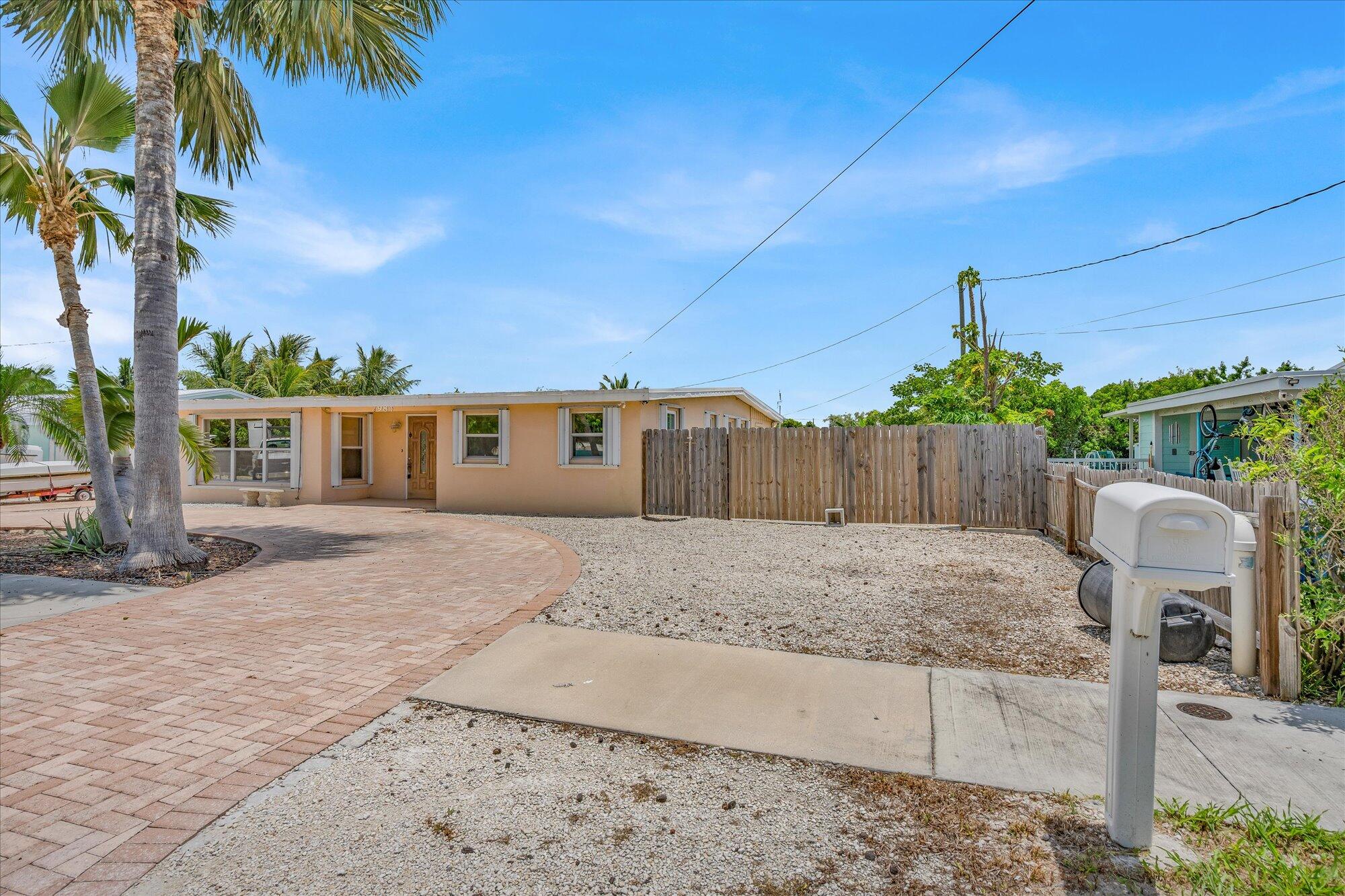7984 Tuna Drive Marathon, FL 33050 - Photo 2 of 40 a backyard of a house with seating space