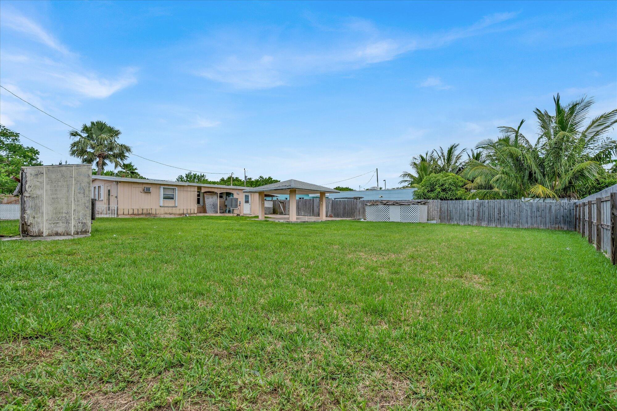 7984 Tuna Drive Marathon, FL 33050 - Photo 30 of 40 a view of house with backyard space and garden