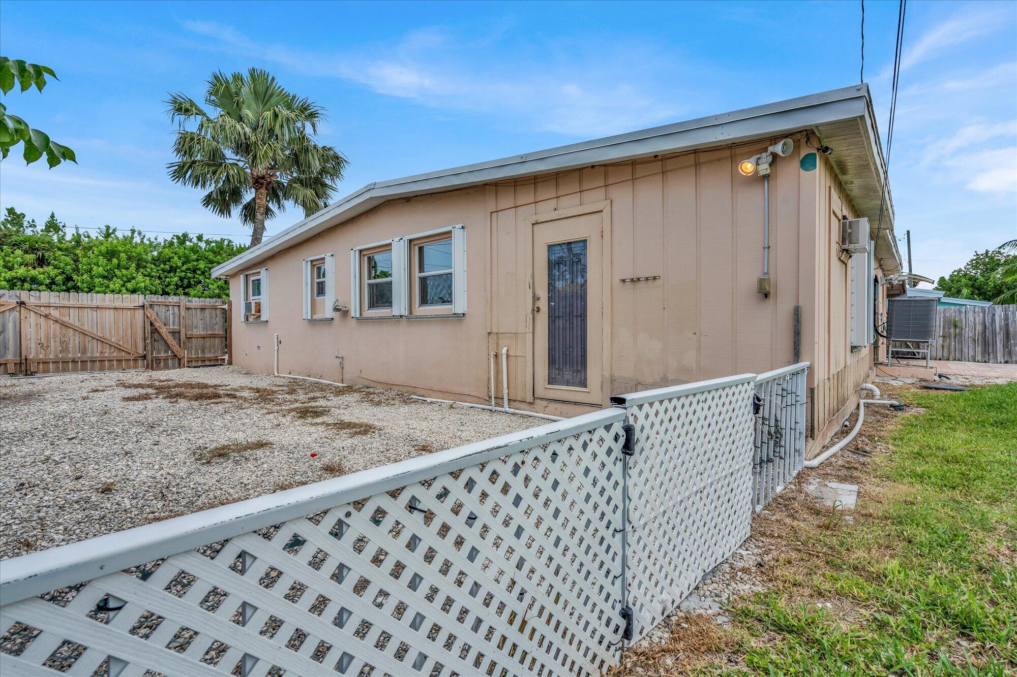 7984 Tuna Drive Marathon, FL 33050 - Photo 32 of 40 a view of house with wooden fence