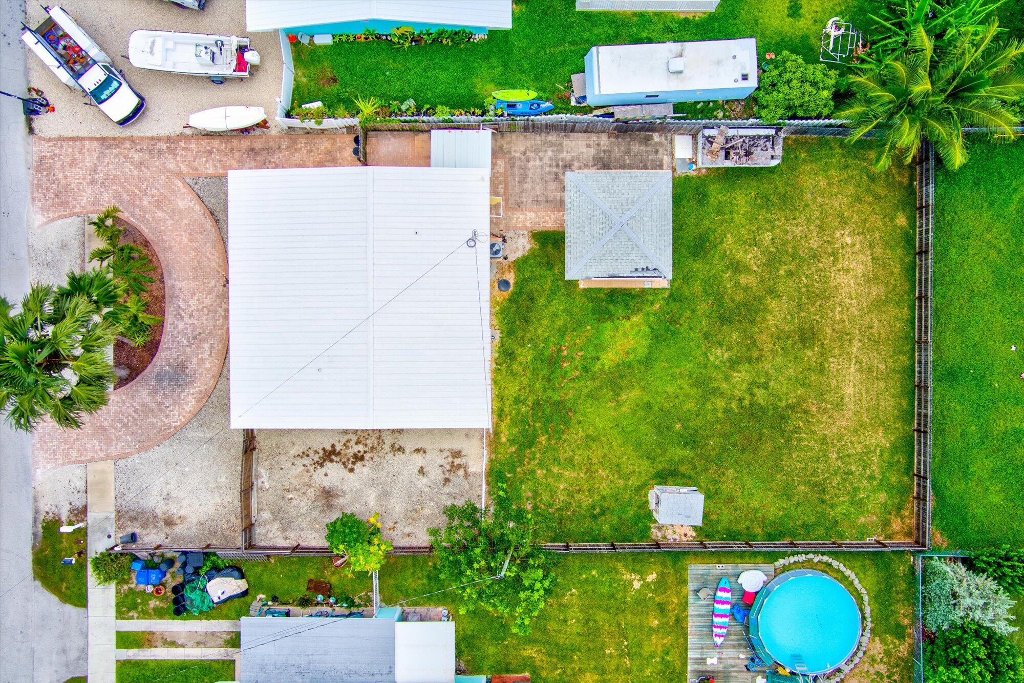 7984 Tuna Drive Marathon, FL 33050 - Photo 33 of 40 an aerial view of a house with a yard and lake view
