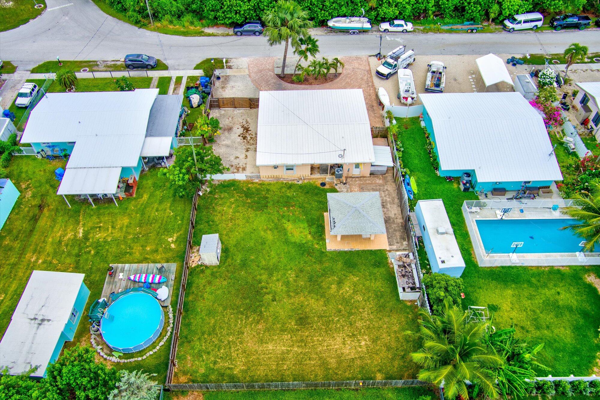 7984 Tuna Drive Marathon, FL 33050 - Photo 34 of 40 an aerial view of a house with swimming pool garden and outdoor seating