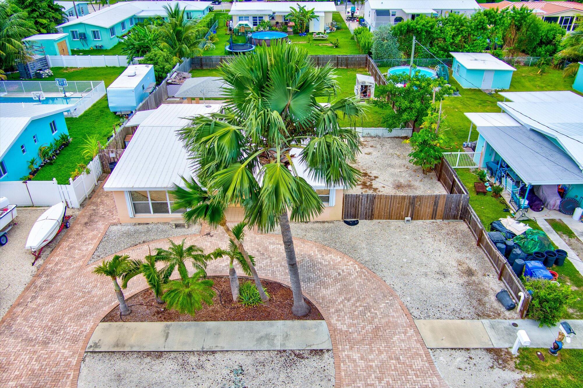 7984 Tuna Drive Marathon, FL 33050 - Photo 5 of 40 an aerial view of a house with a yard and garden