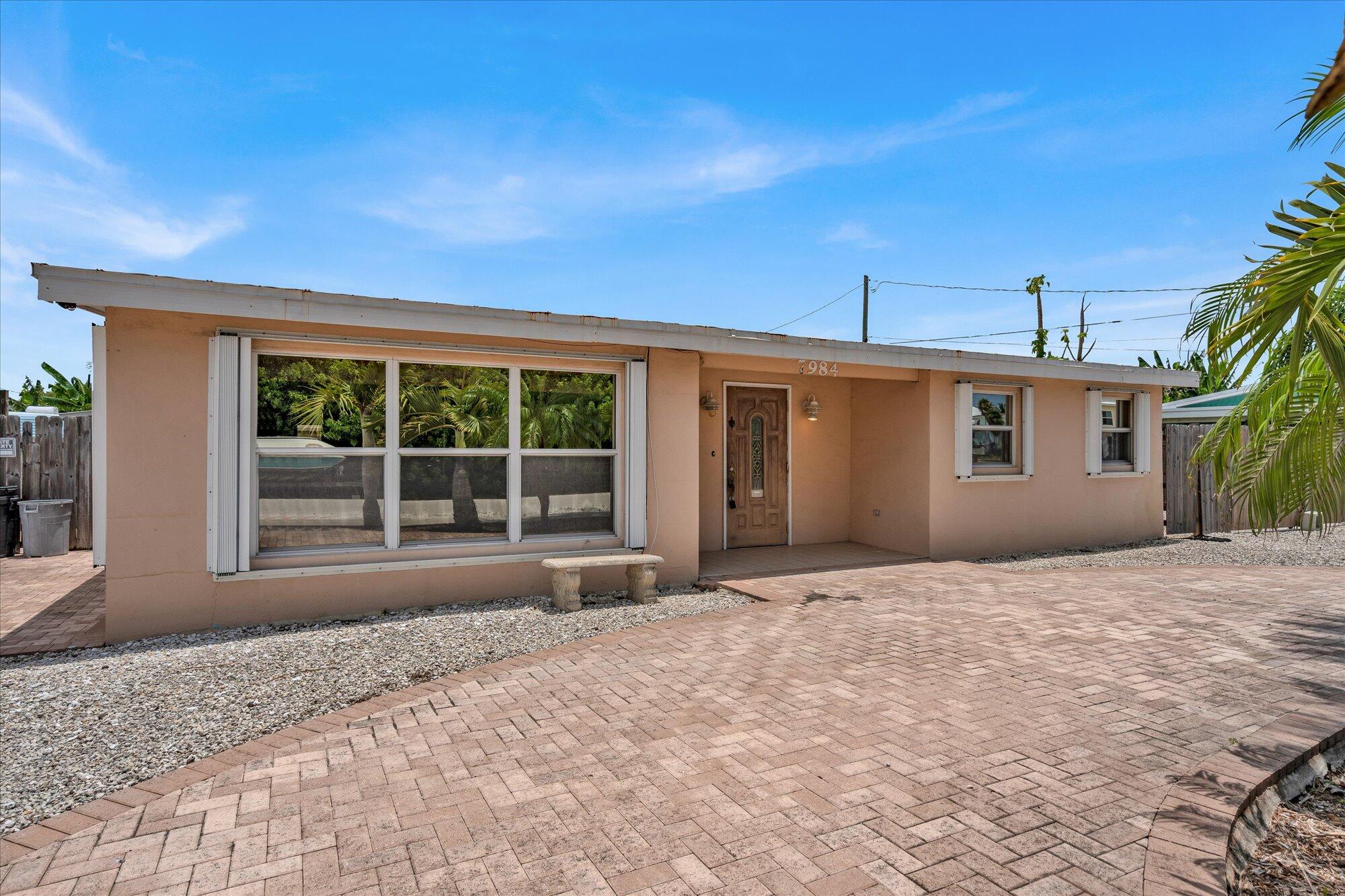 7984 Tuna Drive Marathon, FL 33050 - Photo 6 of 40 a view of a house with a backyard and balcony