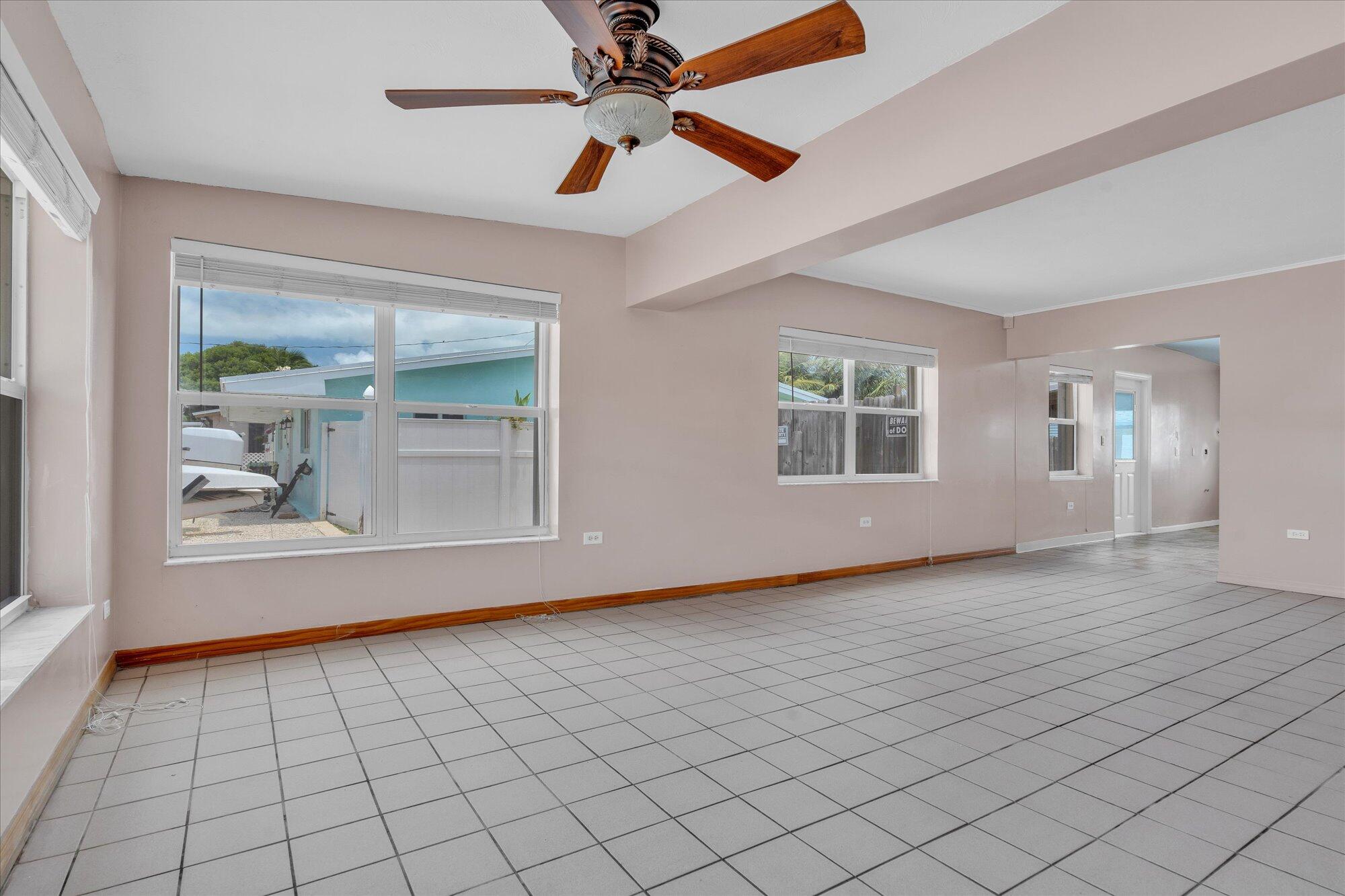 7984 Tuna Drive Marathon, FL 33050 - Photo 8 of 40 an empty room with windows and ceiling fan