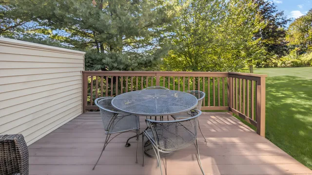 a view of a balcony with a table and chairs
