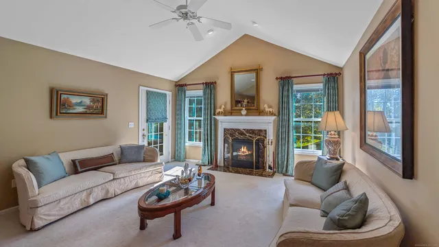 a bathroom with a sink vanity granite and a mirror