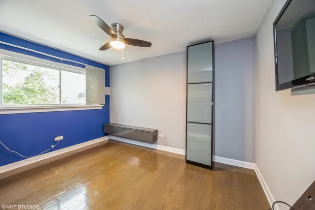 a view of room with window and ceiling fan