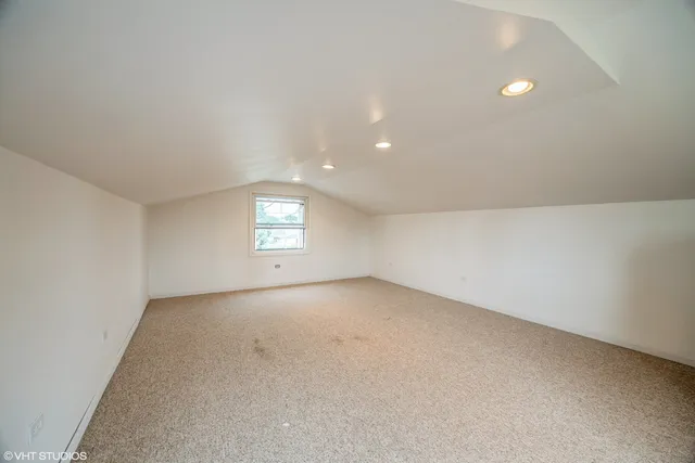 an empty room with a window and a space