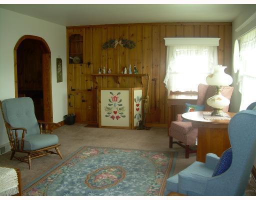 1918 Marshall Road Monaca, PA 15061 - Photo 3 of 8 Living Room. ADORABLE, roomy, newer windows, decorative fireplace, hardwood underneath carpeting! Nice touches.