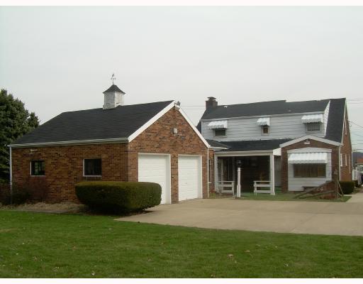 1918 Marshall Road Monaca, PA 15061 - Photo 8 of 8 Exterior Back. Attached 2 car garage, level concrete parking area, beautiful piece of property!