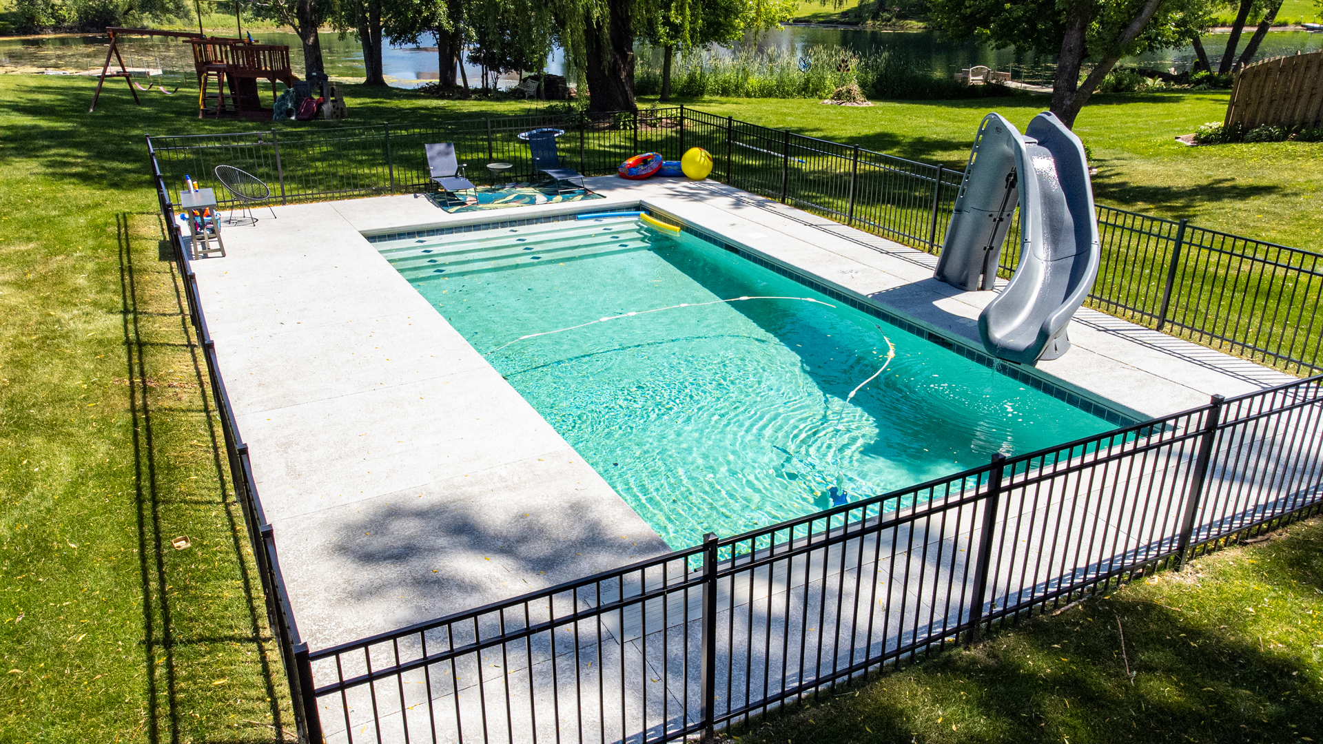 14N651 Timber Ridge Drive Elgin, IL 60124 - Photo 54 of 69 a view of a swimming pool with a patio and a garden