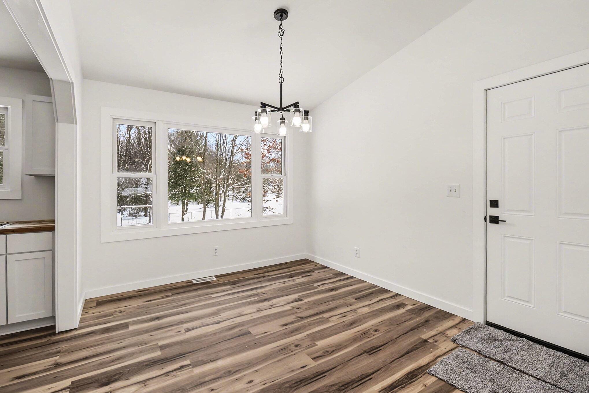 7131 West No Name Road Ludington, MI 49431 - Photo 10 of 28 Dining with door to garage