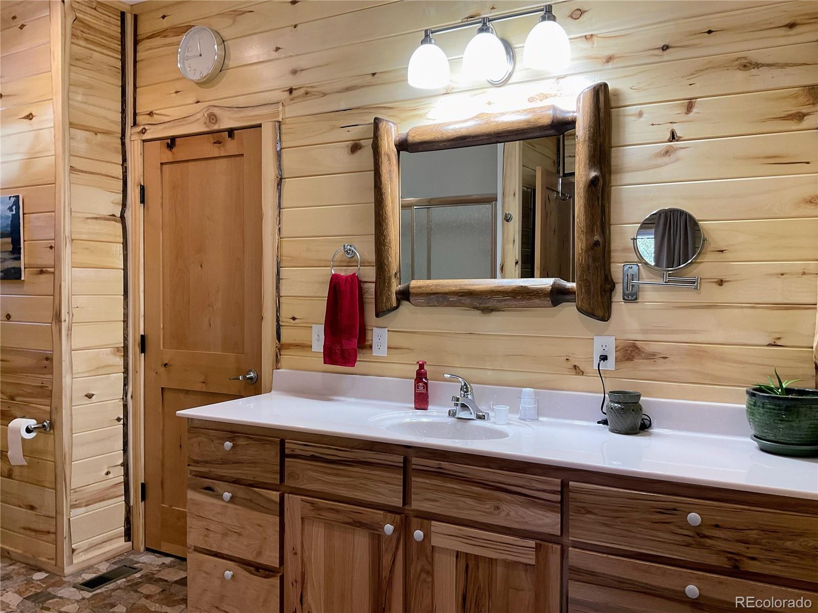2945 Forbes Park Road Fort Garland, CO 81133 - Photo 13 of 36 a bathroom with a sink and a mirror