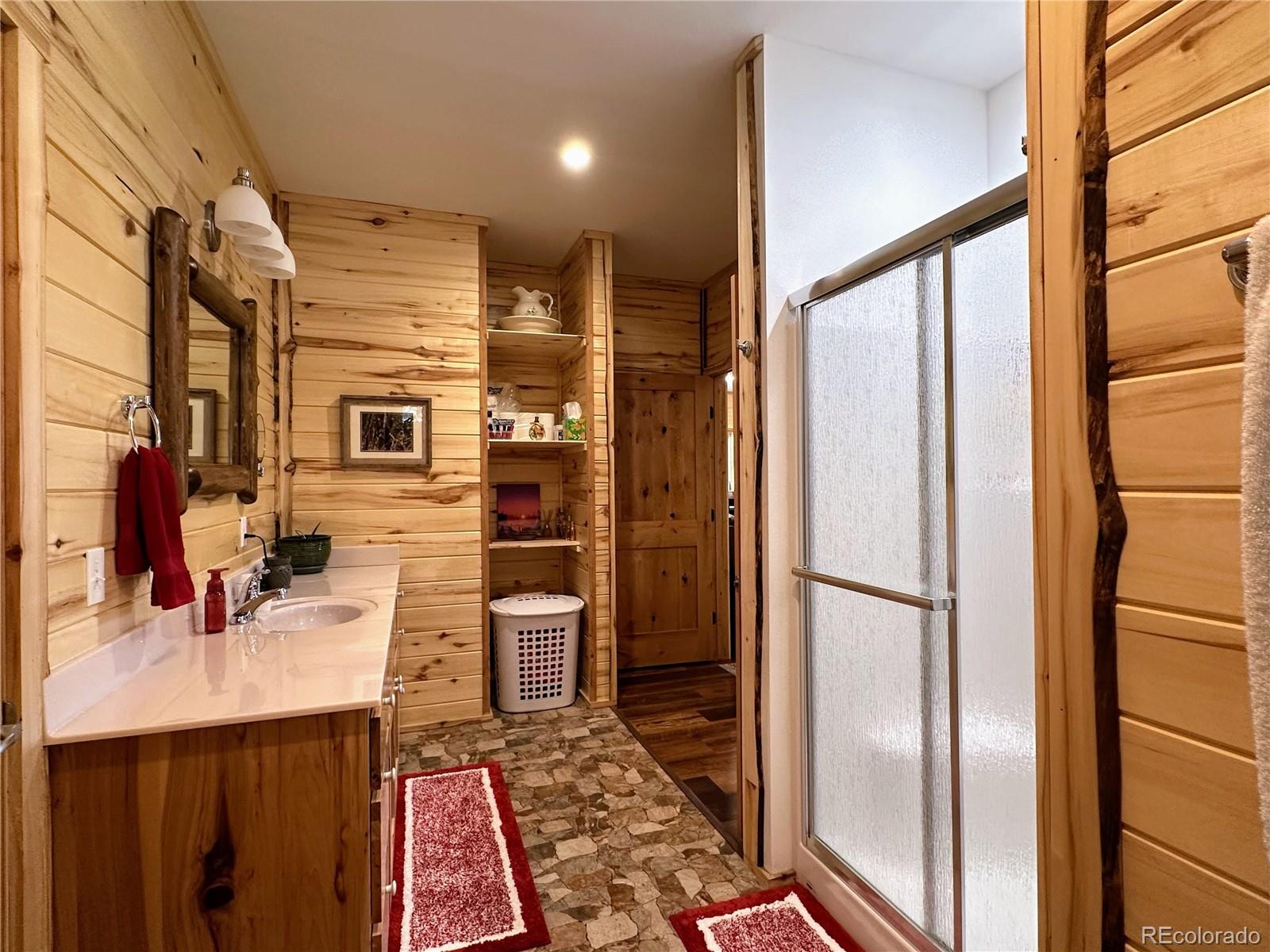 2945 Forbes Park Road Fort Garland, CO 81133 - Photo 14 of 36 a bathroom with a sink and a mirror