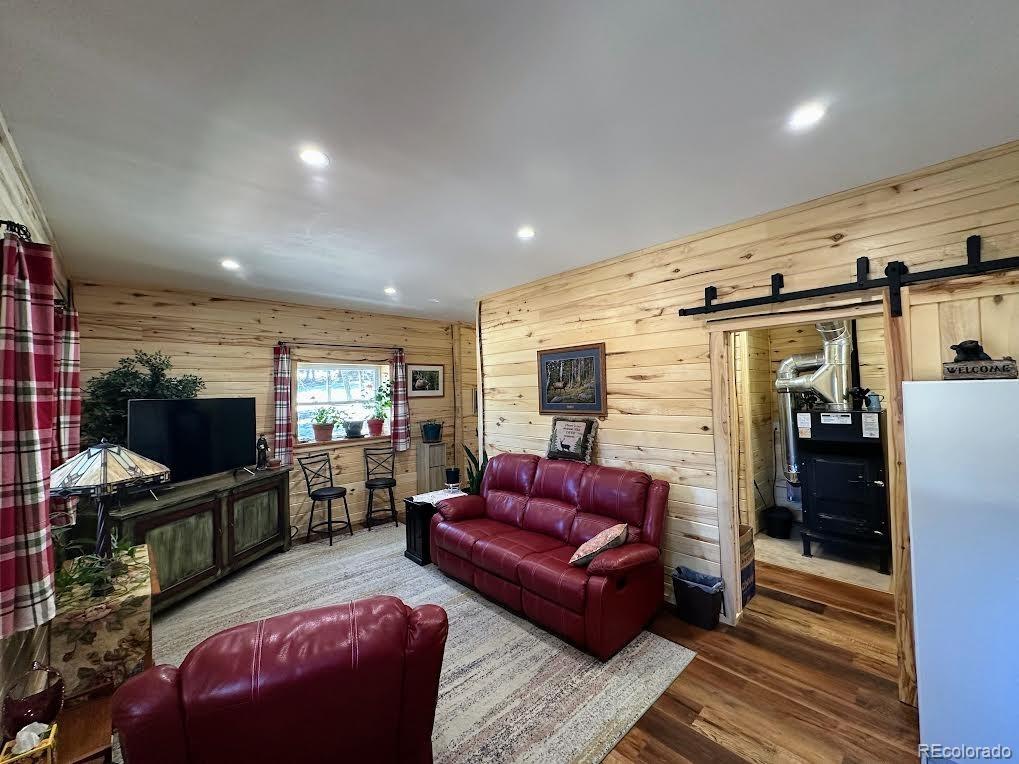 2945 Forbes Park Road Fort Garland, CO 81133 - Photo 17 of 36 a living room with furniture and a flat screen tv