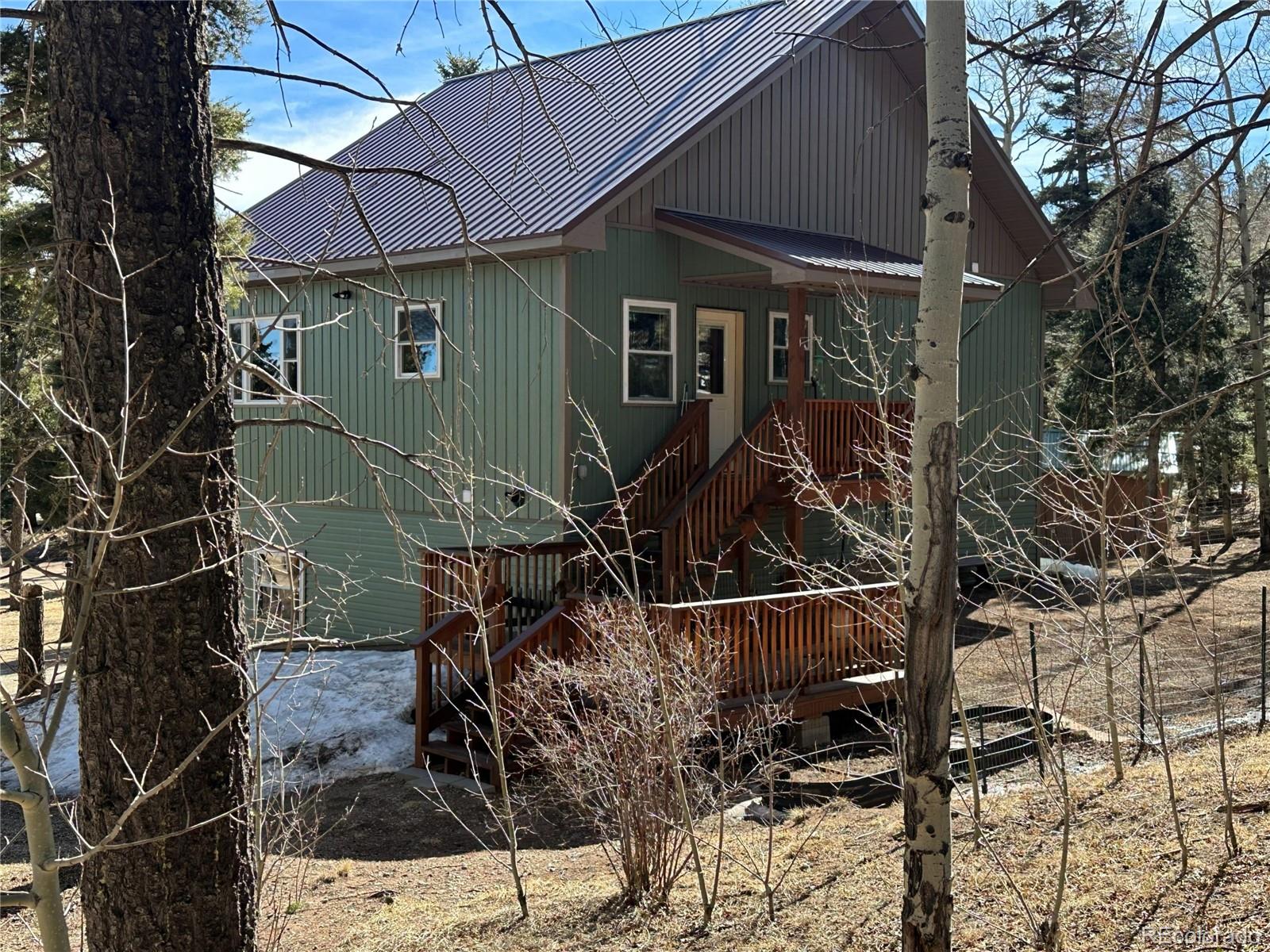2945 Forbes Park Road Fort Garland, CO 81133 - Photo 3 of 36 a view of a house with backyard and sitting area