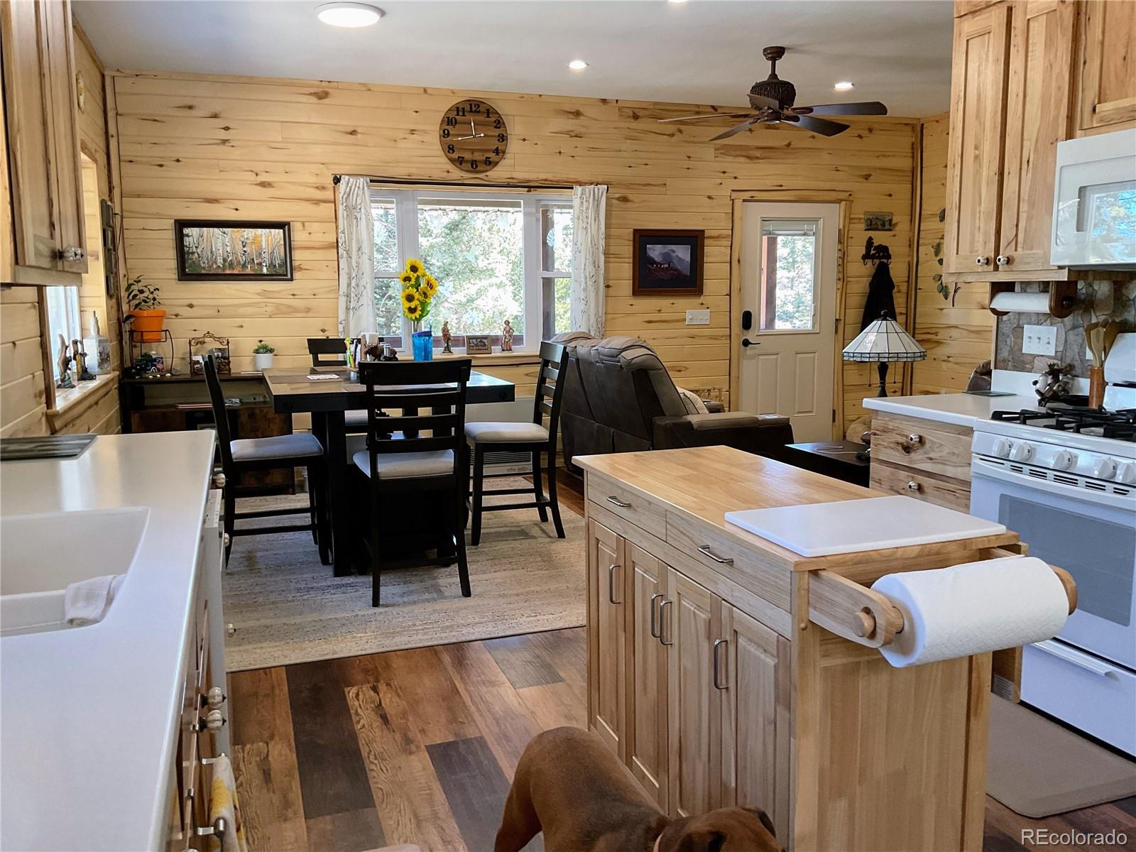 2945 Forbes Park Road Fort Garland, CO 81133 - Photo 8 of 36 a living room with furniture a large window and stainless steel appliances