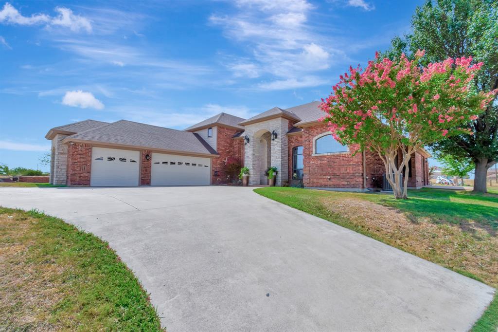 5520 White Settlement Road Weatherford, TX 76087 - Photo 3 of 40 a front view of house with yard and green space