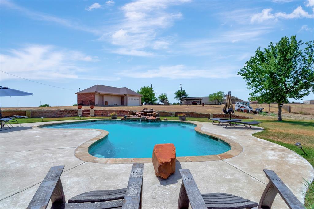 5520 White Settlement Road Weatherford, TX 76087 - Photo 7 of 40 a swimming pool with outdoor seating and yard