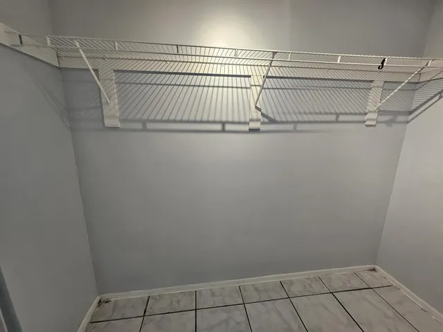 a view of a room with racks on the wall