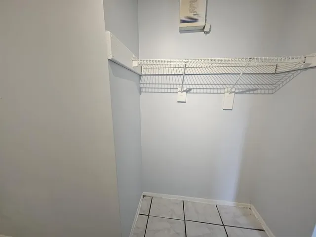 a view of a room with racks on the wall