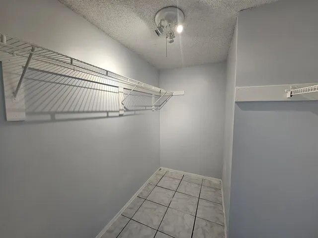 a view of a room with racks on the wall