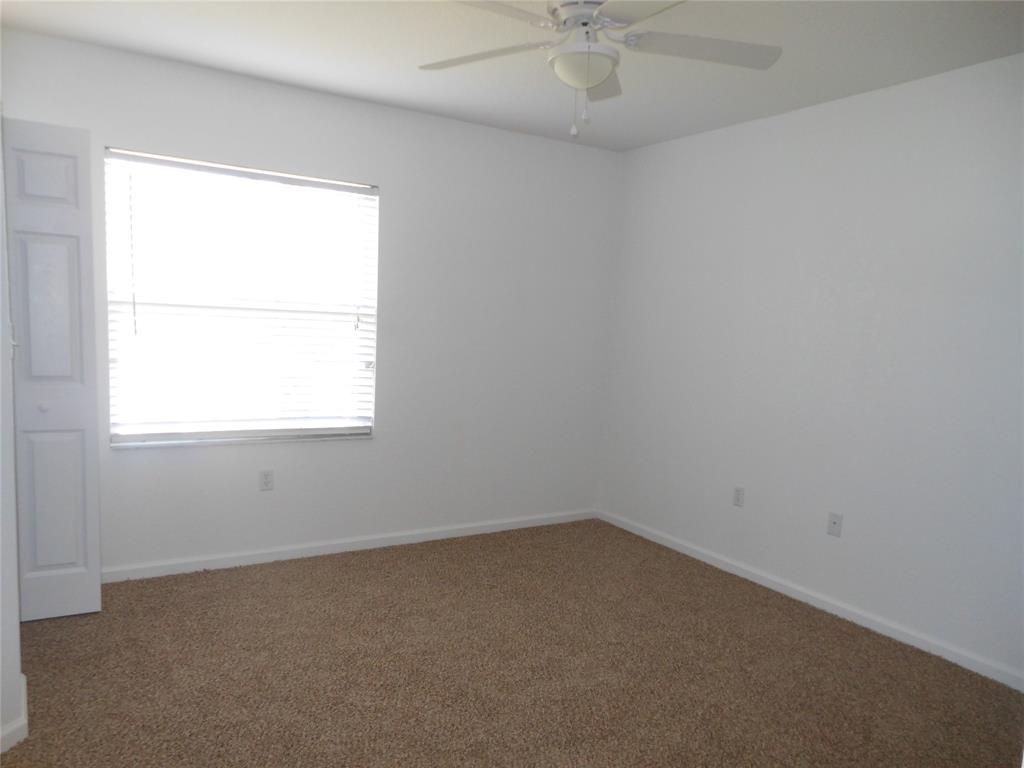 6366 Landings Way, Unit 6366 Tamarac, FL 33321 - Photo 12 of 19 an empty room with a window