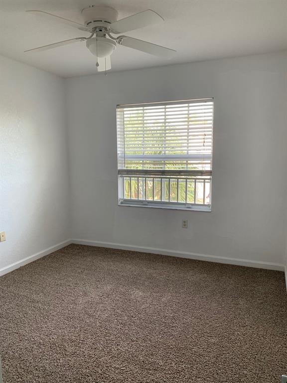 6366 Landings Way, Unit 6366 Tamarac, FL 33321 - Photo 15 of 19 an empty room with a window