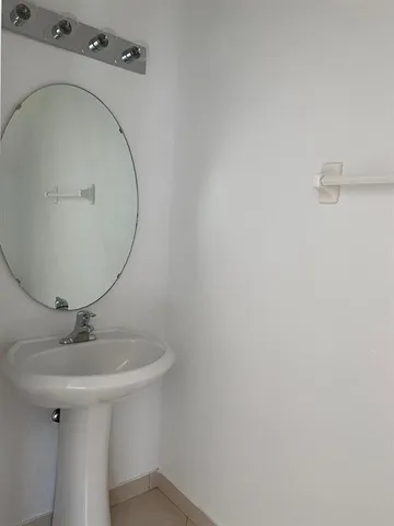 a bathroom with a sink and mirror