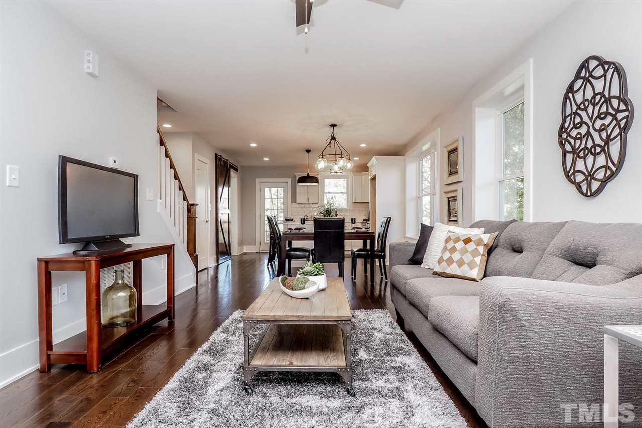 306 Freeman Street Raleigh, NC 27601 - Photo 6 of 25 a living room with furniture and a flat screen tv