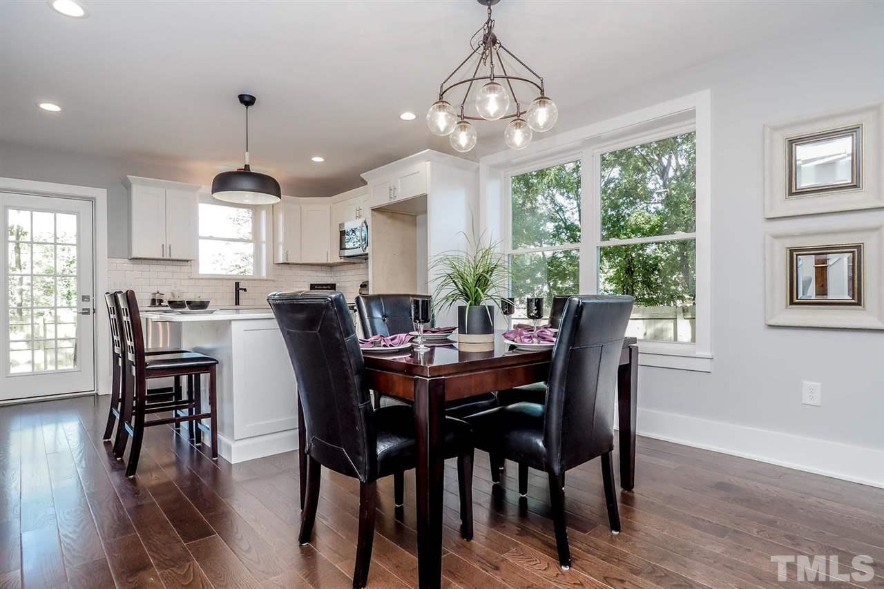 306 Freeman Street Raleigh, NC 27601 - Photo 7 of 25 a view of a dining room with furniture window and wooden floor