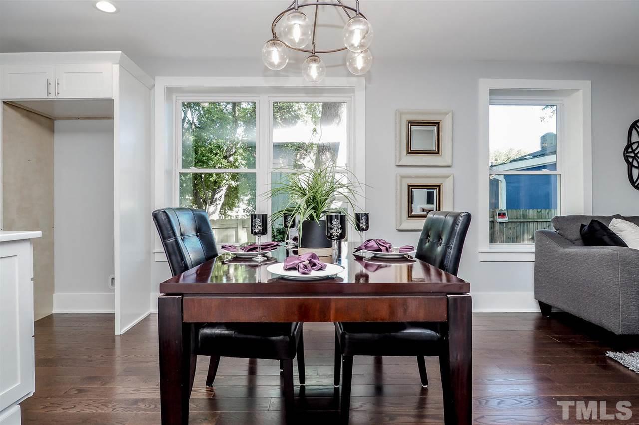 306 Freeman Street Raleigh, NC 27601 - Photo 8 of 25 a view of a dining room with furniture window and wooden floor