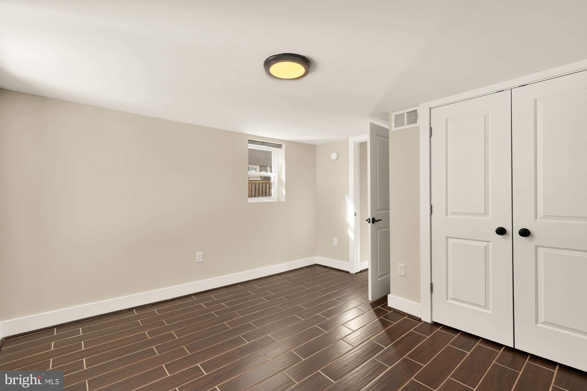 6519 Piney Branch Road Northwest Washington, DC 20012 - Photo 43 of 47 a view of livingroom with wooden floor and window