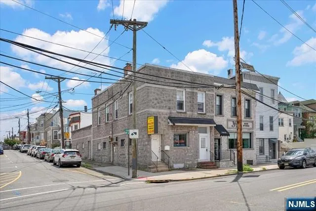 a city street lined with parked cars