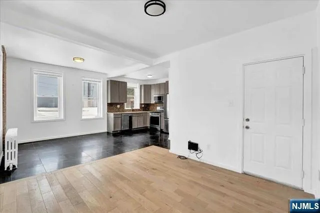 a view of a livingroom with furniture and wooden floor