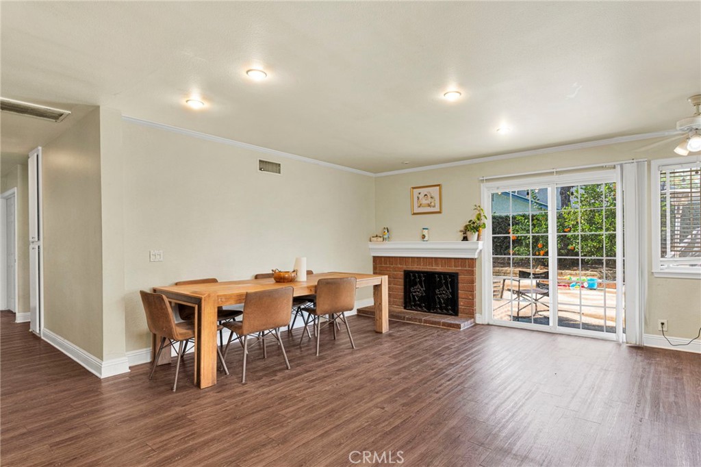 1087 Baseline Road La Verne, CA 91750 - Photo 12 of 39 a view of a livingroom with furniture fireplace and wooden floor