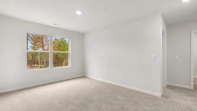 a view of a bathroom from the hallway