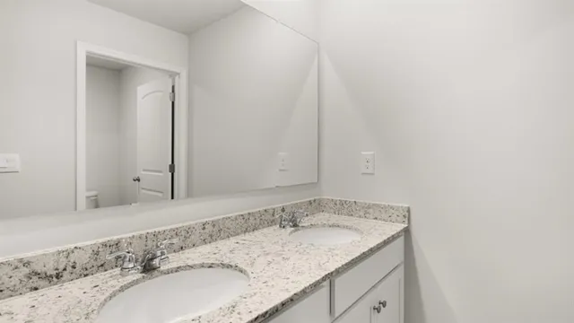 a white bath tub sitting next to a white toilet