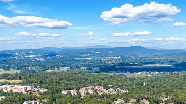an aerial view of a house with a big yard