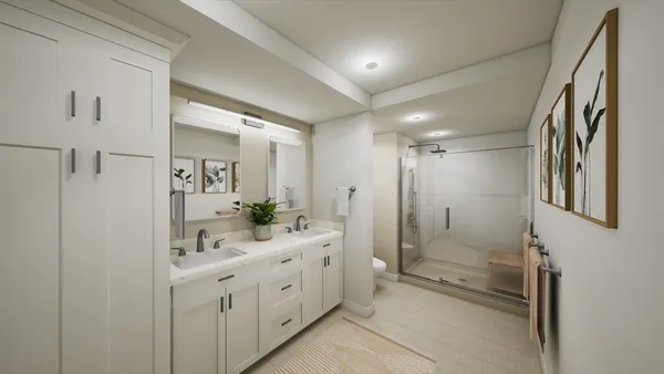 a bathroom with double vanity sink and mirror