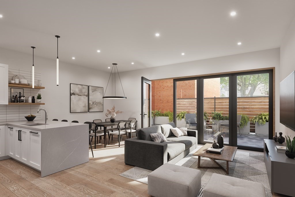 3171 Washington Street, Unit 101 Boston, MA 02130 - Photo 1 of 10 a living room with furniture and a large window