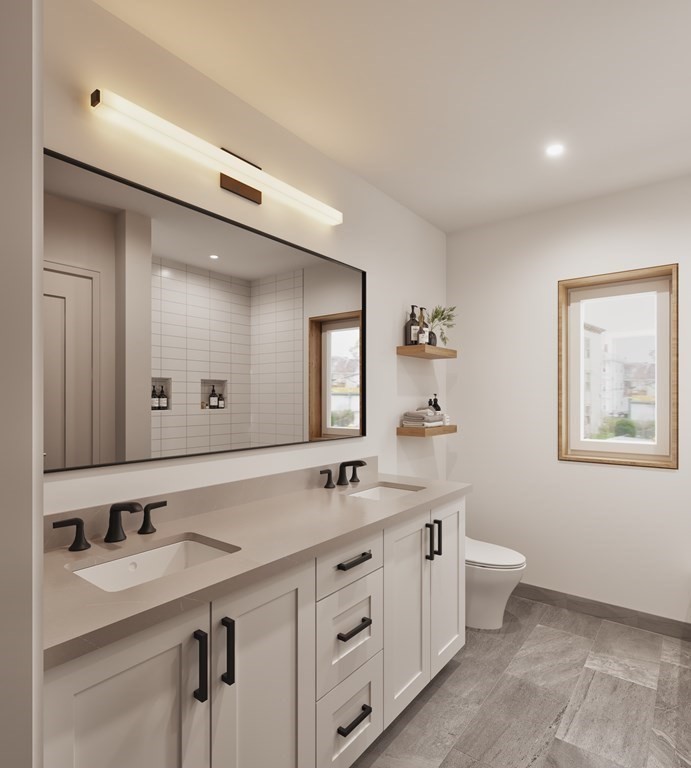 3171 Washington Street, Unit 101 Boston, MA 02130 - Photo 6 of 10 a spacious bathroom with a granite countertop sink and a mirror