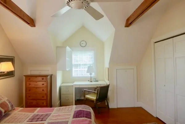 a bedroom with a bed and a table in it