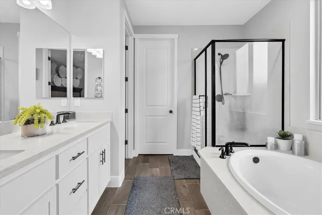 a bathroom with a tub and shower