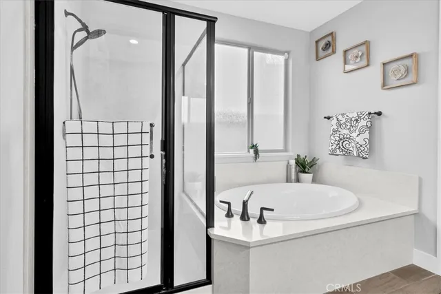 a bathroom with double vanity sink and a mirror
