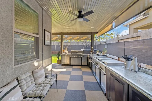 a kitchen with stainless steel appliances granite countertop a sink and cabinets