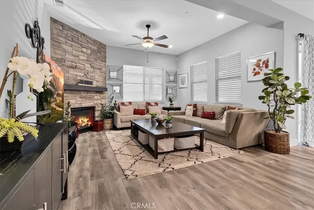 a living room with lots of furniture and kitchen view